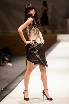 Amy Wang strikes a pose in Goldstein Auditorium, modeling an outfit designed by Hayley Neremberg. 