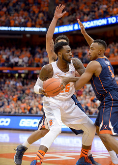 Christmas looks to make a play as two Virginia defenders hound him in the first half. 