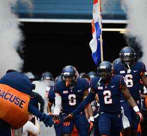 Cornerback Wayne Morgan leads the charge onto the field before Syracuse's Spring Game on Saturday.
