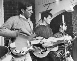 Lou Reed (center) plays in front of the Sigma Alpha Mu fraternity house in 1961 or 1962. Reed, an influential music legend, developed much of his musical style while a student at Syracuse University.