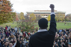 Colton Jones, a senior psychology major and a rally organizer, leads the crowd in a chant during the Diversity and Transparency Rally on Nov. 3, 2014.