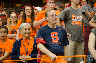 Chancellor Kent Syverud and his wife Ruth Chen cheer with BBB residents during the annual Home to the Dome event on August 21, 2014.