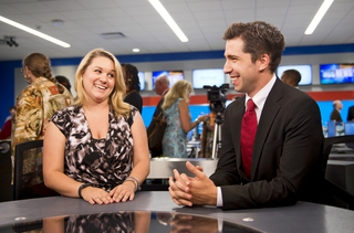 Robin Deehan and Andrew Polino, both graduate students studying broadcast and digital journalism, stand inside the newly renovated studios in Newhouse II.