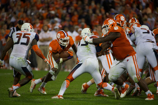 The SU defense collapses on a Clemson running back. 