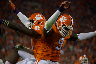 Two Clemson players celebrate during their 16-6 win on Saturday. 