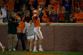 Stanton Seckinger raises his arms up after scoring a touchdown in the fourth quarter. 