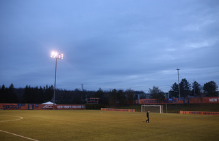 McIntyre paces the SU Soccer Stadium field after his team's second-round victory.