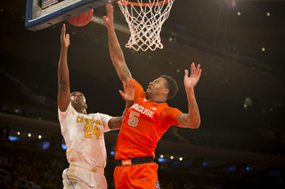 SU freshman Chris McCullough skies up to block a shot in the first half. 