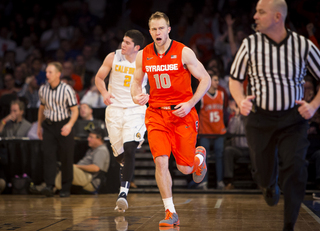 SU shooting guard Trevor Cooney gets fired up as he jogs back on defense after making a 3-pointer from the corner. 