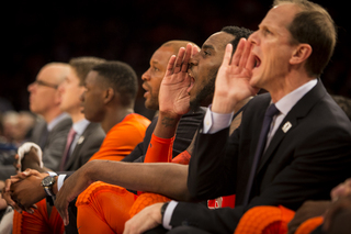 Orange assistant coach Mike Hopkins (right) and Christmas (left) yell from the bench. 