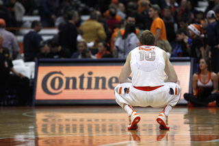 Cooney crouches on the court during Syracuse's loss. The Orange lost at home against a nonconference opponent for the first time since 2008. 