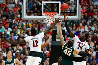 Louisville's defense fights for a rebound in the paint over Michigan State's Valentine.