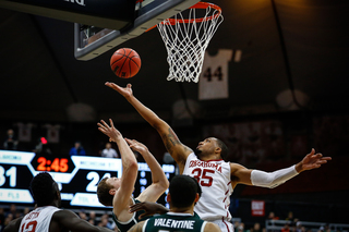 Oklahoma's TaShawn Thomas (35) towers over MSU's offense in attempt to grab a rebound late in the second half.