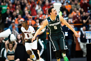 Forbes celebrates after Michigan State pulls ahead of Louisville in the second half.