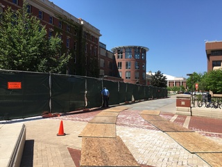 A fence was set up around Sims Hall and the Shaffer Art Building to prepare for the promenade construction. Photo taken June 1, 2016