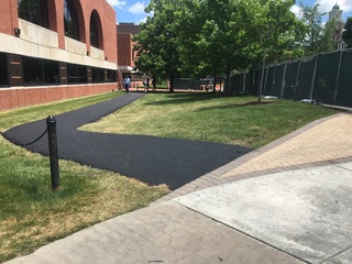 Temporary sidewalks have been created along parts of University Place due to the promenade construction. Photo taken June 8, 2016