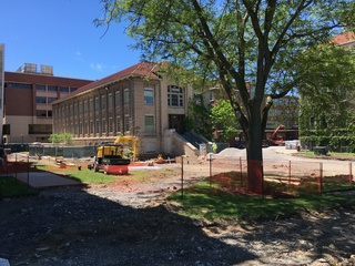 The asphalt for the parking lot and road in front of Machinery Hall has been removed as part of the summer construction o Syracuse University's campus. Photo taken June 15, 2016