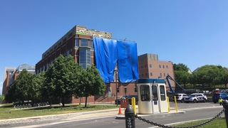 A blue tarp covers the Life Sciences Complex at Syracuse University as workers started to make repairs. Photo taken June 1, 2016