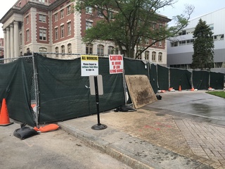 Signs have been posted at various construction sites around the Syracuse University campus, including ones warning workers of low-flying hawks. Photo taken July 7, 2016