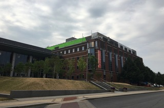 Construction continues on the Life Sciences Complex as the siding on the mechanical penthouse on the building's roof is being repaired. Photo taken July 7, 2016