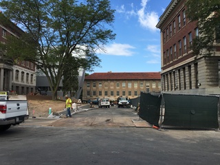 Some of the fencing around Slocum Hall has been taken down after paving was completed, but the construction project is not yet complete. Photo taken July 22, 2016