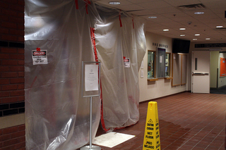 Plastic sheets and signs have been put up near the Schine Box Office inside the Schine Student Center to caution people from walking near that area. Photo taken July 28, 2016