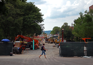 Numerous pieces of construction equipment line University Place as the university enters its final month of work on the promenade. Photo taken July 28, 2016