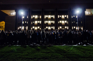 Students gathered outside of Bird Library in preparation for the vigil.